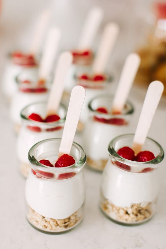 a yogurt bar with fresh yogurt, berries and granola is a very healthy and cool idea for a brunch wedding