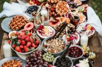 12 a perfect wedding brunch grazing table with granola, waffles, berries, fruits, parfait and croissants is a gorgeous idea