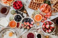 14 a lovely savory waffle bar with berries, fruits, fried eggs, sauces and lots of waffles is a fab idea for a wedding brunch