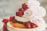 27 a lovely two-tier wedding cheesecake with fresh strawberries and blush roses is a very beautiful idea to try