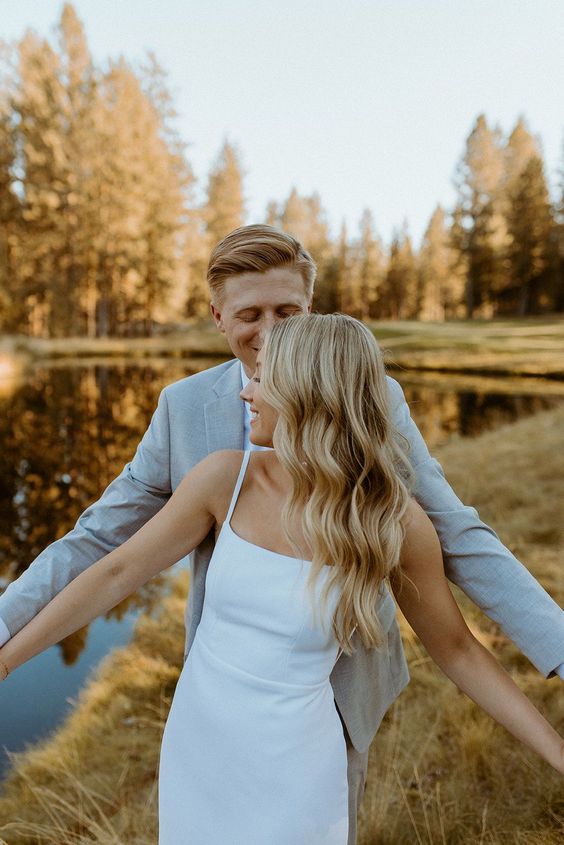a modern fitting plain wedding dress with straps is a cool idea for a modern and romantic bride, though such a skirt isn't the most comfortable in wearing