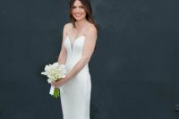 a strapless plain sheath wedding dress with a plunging neckline and a train is very elegant and suitable for a modern lux wedding