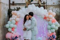 a gorgeous wedding backdrop with a balloon