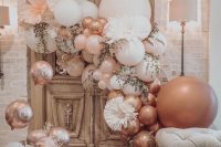 a wedding lounge styled with blush and pink balloons, pink blooms and greenery is a very chic and cheerful idea to rock