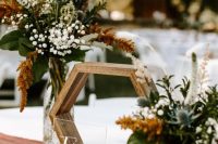 a cute wedding table with baby breath’s centerpieces