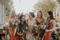 matching rust-colored midi bridesmaid dresses and nude shoes are a timeless idea for a fall or summer boho wedding