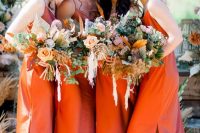 bold bridesmaids in orange dresses