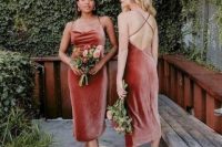 rust-colored midi spaghetti strap bridesmaid dresses with criss cross backs are chic for a bright fall wedding