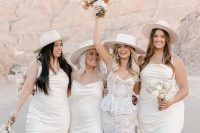 white slip midi bridesmaid dresses, silver heels and hats are amazing for a boho spring or summer bridal party