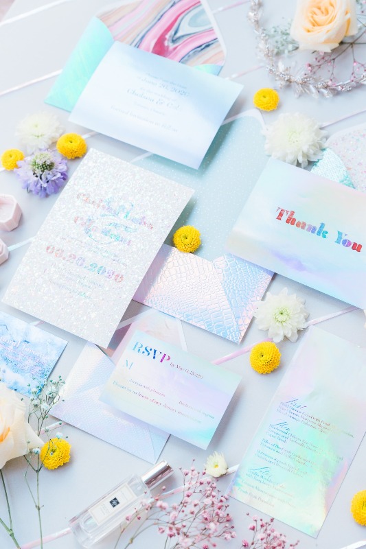 an iridescent wedding invitation set with beautiful and shiny pieces and much texture is a very refined idea