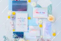 05 an iridescent wedding invitation suite with colorful letters, with pretty blooms and greenery is a lovely idea to rock