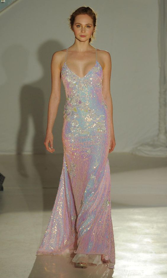 a holographic spaghetti strap wedding dress with a deep V-neckline is a bold statement at a wedding