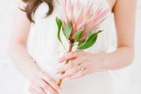 12 a single stem wedding bouquet of a pink king protea is a lovely idea for a modern or minimalist bride, it’s an easy solution