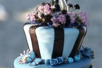 15 a blue and black wedding cake with butterflies, beads, lilac and black blooms and Victor and Sally cake toppers is cool