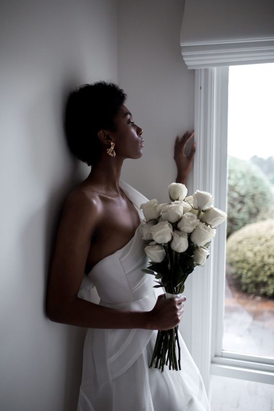 a chic and elegant white rose long stem wedding bouquet will never go out of style and will make your look very refined