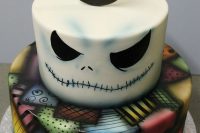 17 a bold Jack Skellington wedding cake with bright decor is a cool idea for a themed wedidng, it looks unusual and bold
