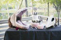 27 a Tim Burton wedding cake in black, white and pink, with fun Tim Burton movies’ decor around is a gorgeous idea