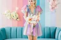 27 an iridescent wedding backdrop, a turquoise sofa, a colorful wedding dress and a pastel wedding bouquet for a lovely iridescent wedding