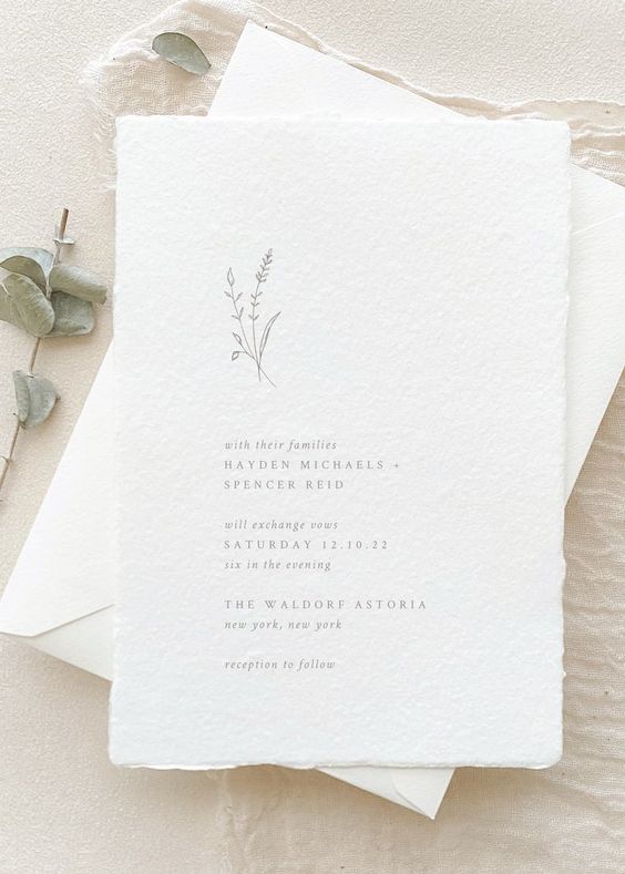 a delicate and ethereal minimalist wedding invitation suite with textural paper and grey lettering is a gorgeous idea for a minimal wedding