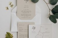 a lovely tan and white minimalist wedding invitation suite with small black lettering, a printed map and botanical prints and patterns