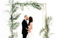 a minimalist tropical wedding arch design