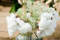 a rustic wedding centerpiece of bunny tails, baby’s breath and cotton is always a good idea for both rustic and boho wedding