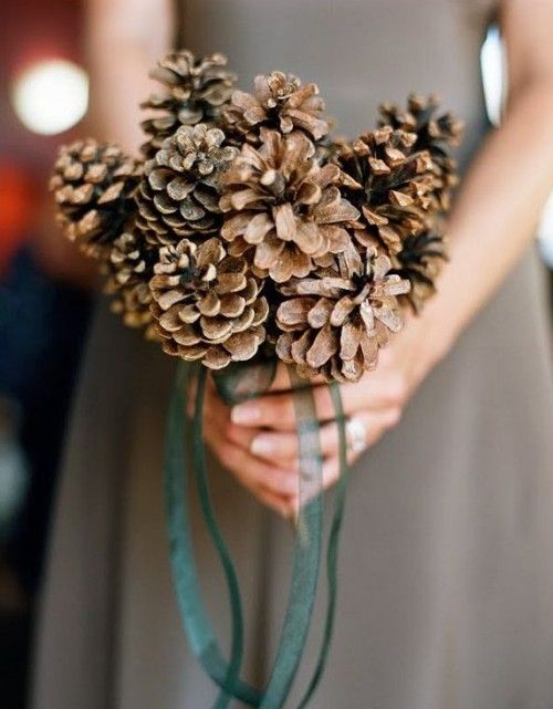 a simple only pinecone wedding bouquet with green ribbons is a lovely idea for both a fall or a winter wedding and it will save your budget