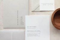 a subtle minimalist wedding invitation suite done in undertones, with stylish calligraphy and lettering and white stamps is cool