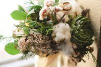a textural wedding bouquet of cotton, succulents, greenery, dried blooms, ferns is a very pretty and cool idea for the fall
