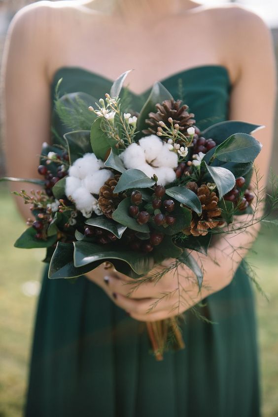 a woodland wedding bouquet of pinecones, cotton, berries, foliage is a lovely idea for both a fall or winter wedding