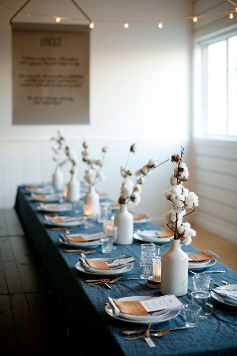 modern wedding centerpiece of white vases with cotton branches can be rocked at any boho wedding, in the fall or winter