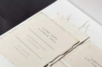 the hand-torn edges and tea-stained patina of this invitation suite give the stationery elements an elegant, antiqued look that will look classic for years