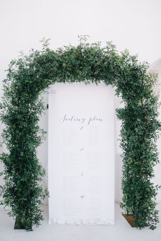 a super lush greenery wedding arch is a cool idea for a modern wedding, it will look great at spring and summer weddings