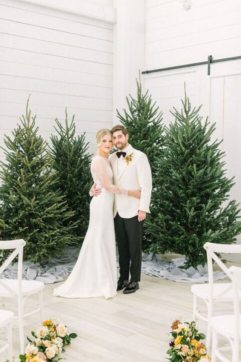 beautiful Christmas trees are a fantastic backdrop for a Christmas wedding, they require no decor at all as they already look gorgeous