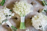 a beautiful small lily of the valley wedding bouquet with a white ribbon wrap is a chic idea for a spring or summer wedding