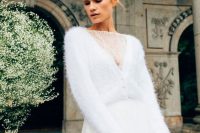 a beautiful yet casual winter bridal look with a lace bodysuit, a fuzzy cardigan with pearl buttons and a tulle maxi skirt