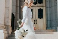 a lovely and rather casual bridal look with a neutral cardigan as a shirt and a tiered tulle midi skirt, orange shoes for winter