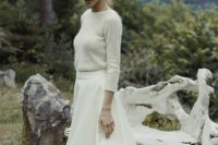 a neutral sweater, a white A-line midi skirt, silver shoes for a pretty and lovely winter bridal look