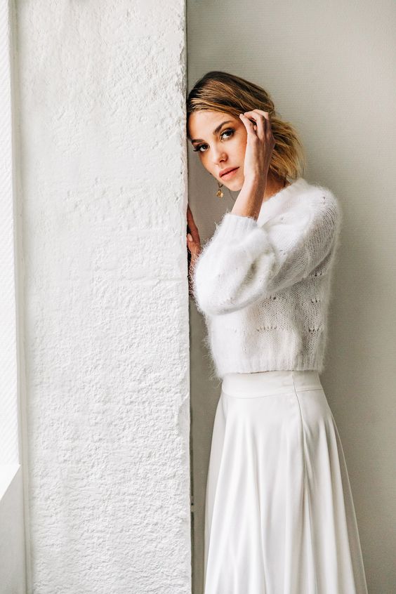 a pretty and cool winter bridal look with a white patterned cropped sweater, a white high waisted skirt and chic amber earrings