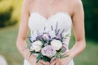 a small and elegant wedding bouquet of white and lilac blooms, lavender and greenery is a beautiful idea for a spring bride
