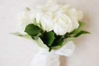 a small white rose and leaf wedding bouquet like this one is timeless classics for every bride and it will fit many bridal outfits