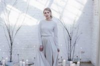 a white cashmere jumper plus an off-white A-line skirt with a train for a casual or minimalist winter bride
