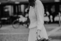 a white fuzzy sweater, a white tulle maxi skirt for an elegant and stylish winter bridal look without going too far