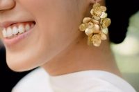 chic gold flower earrings and a modern plain wedding dress will create a very edgy modern and feminine bridal look