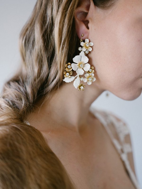 jaw-dropping white and gold rhinestone statement earrings like these ones are fantastic for a gold-infused bridal look