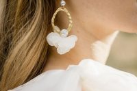 unique and refined white pearl, flower, rhinestones and gold hoop earrings are really an out of the box solution for a bride