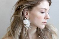 white flower earrings with a wow factor, with gold chains and pearls are amazing to accent a refined bridal look