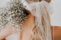 02 a beautiful sheer bow with pearls is a very trendy bridal accessory and a fresh way to wear pearls on your wedding day