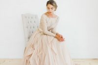 05 a blush wedding dress with a bateau neckline, an embellished bodice and a layered skirt with a train for a dreamy look