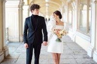 05 a trendy mini wedding dress – a plain one with oversized puff sleeves, neutral shoes and a cool updo for a retro-inspired look